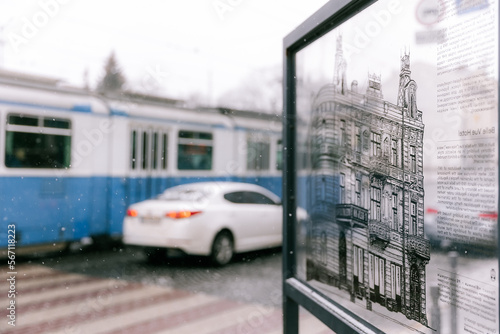 04.12.2022 Vinnitsa  Ukraine  view of the city central of Vinnytsia with blue train on background  selective focus  noise effect