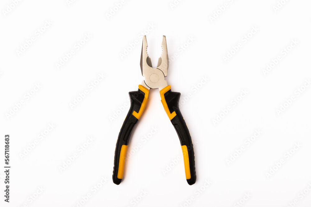 Pliers. Yellow and black pliers isolated on white background. Pliers. Yellow and black pliers isolated on white background.