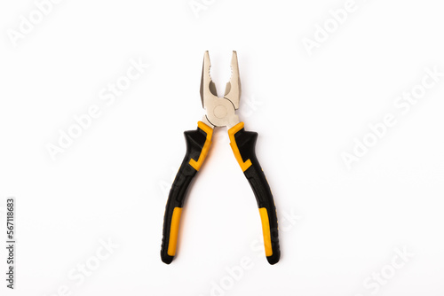 Pliers. Yellow and black pliers isolated on white background. photo