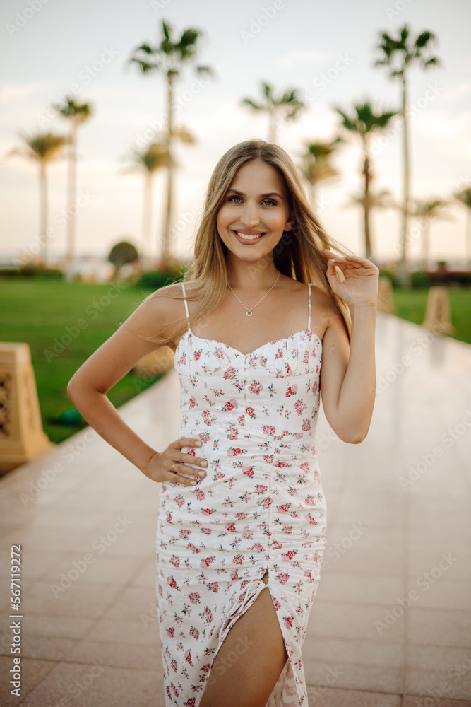 Obraz premium woman in a dress on the beache