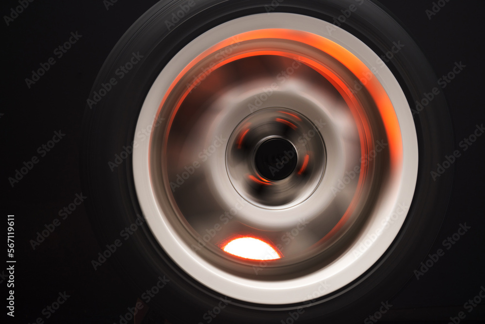 long exposure photography in motion spinning car titanium rims in blurry light long exposure photography in motion spinning car titanium rims in blurry light