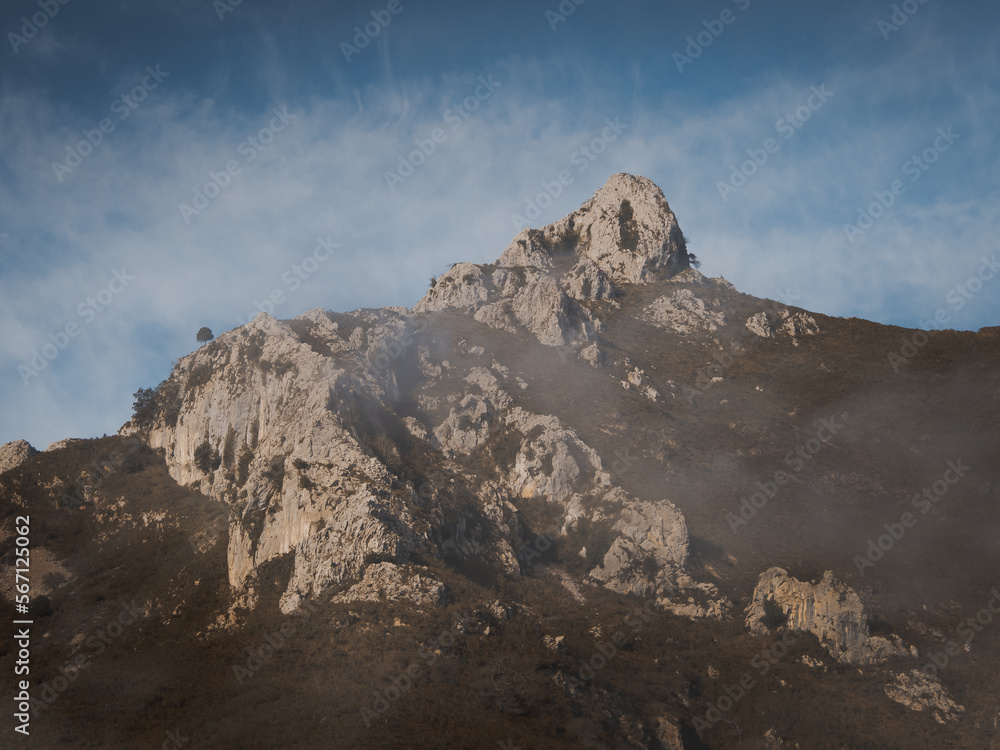 Mountain of Asturias with blue sky with few clouds. Mountains with fog Mountain of Asturias with blue sky with few clouds. Mountains with fog