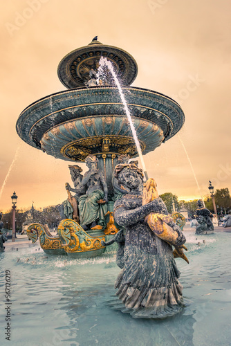 Fountain of the Place de la Concorde square in Paris, France at sunset