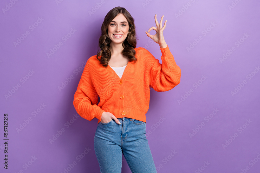 Photo of cheerful gorgeous girl toothy smile hand fingers demonstrate okey symbol isolated on violet color background Photo of cheerful gorgeous girl toothy smile hand fingers demonstrate okey symbol isolated on violet color background
