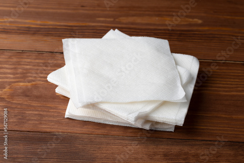White napkins on the table.White napkins on a dark background.