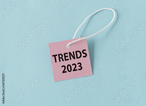 Trends 2023 text quote on a pink card, Business Concept on Blue Background.