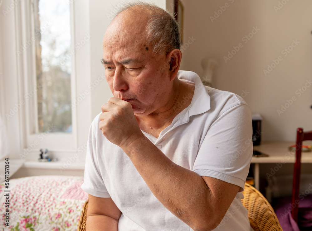 A elderly man coughing. Suffering the symptoms of Winter cold and flu. A elderly man coughing. Suffering the symptoms of Winter cold and flu.