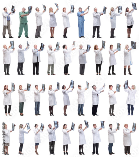 group of doctors holding x-ray isolated on white