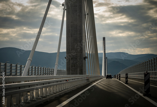 Car driving across new, cable-stayed bridge crossing from croatian land to the Peljesac peninsula, connecting the two parts of croatian coast