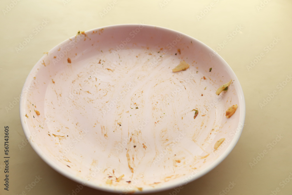 Empty plate after eating on table Empty plate after eating on table