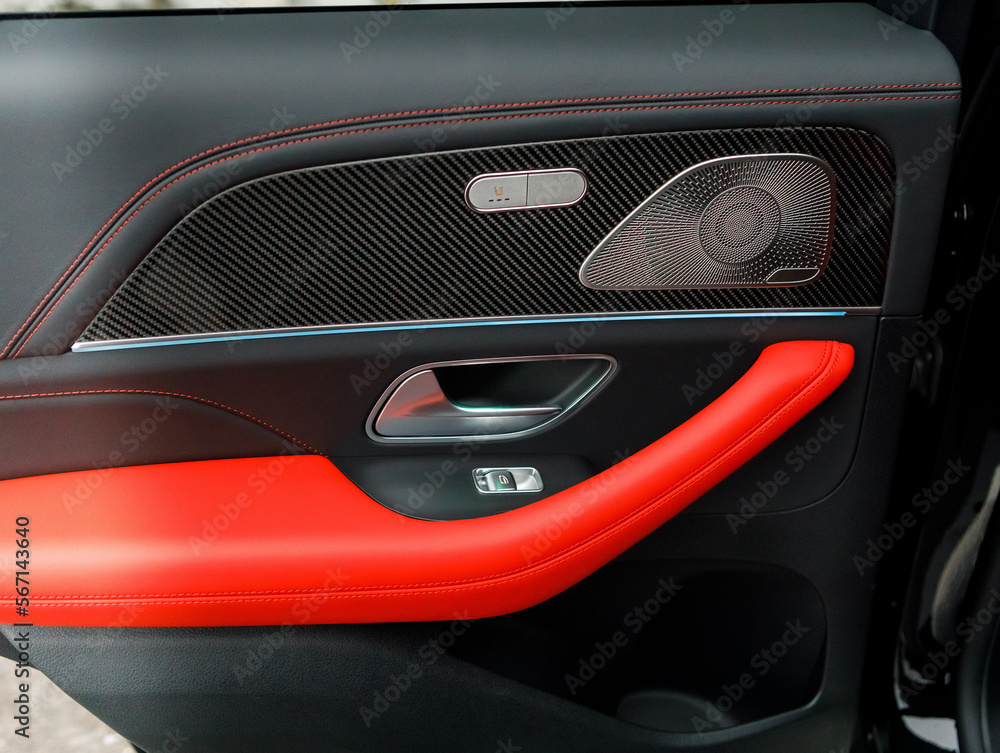 door card of an expensive car with red-black leather and premium audio system