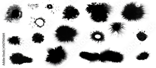 Collection of small and large black dried ink spots or inkblots photo