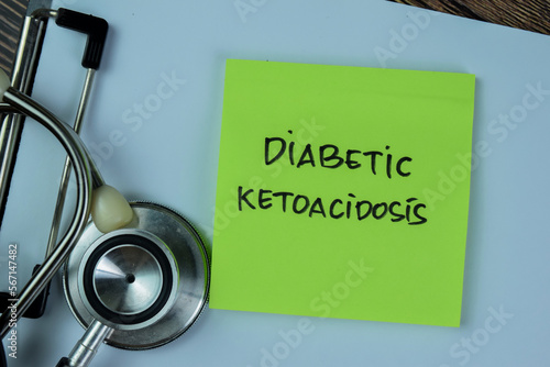 Concept of Diabetic Ketoacidosis write on sticky notes with stethoscope isolated on Wooden Table. photo
