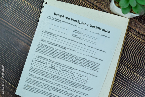 Concept of SBA Form Drug-Free Workplace Certification isolated on Wooden Table. photo