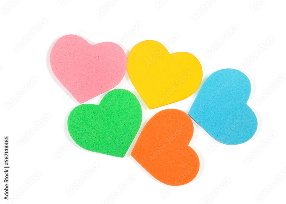 Colorful foam hearts on white background,