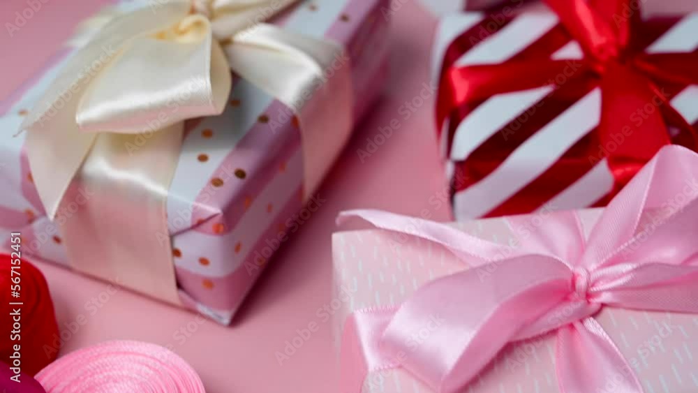 Pink gift box with satin bows, birthday, Mother's Day or Valentine's Day background Pink gift box with satin bows, birthday, Mother's Day or Valentine's Day background