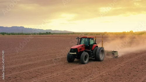 Tractor working in dry field in southern New Mexico