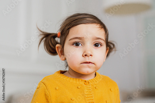 portrait of a little toddler. Baby girl in yellow.