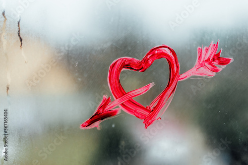 Painted red heart on glass. High quality photo