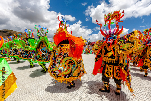 Tableau sur toile Dancers with typical devil costumes and other representations celebrate the festival of the Virgen de la Candelaria in Puno, Peru