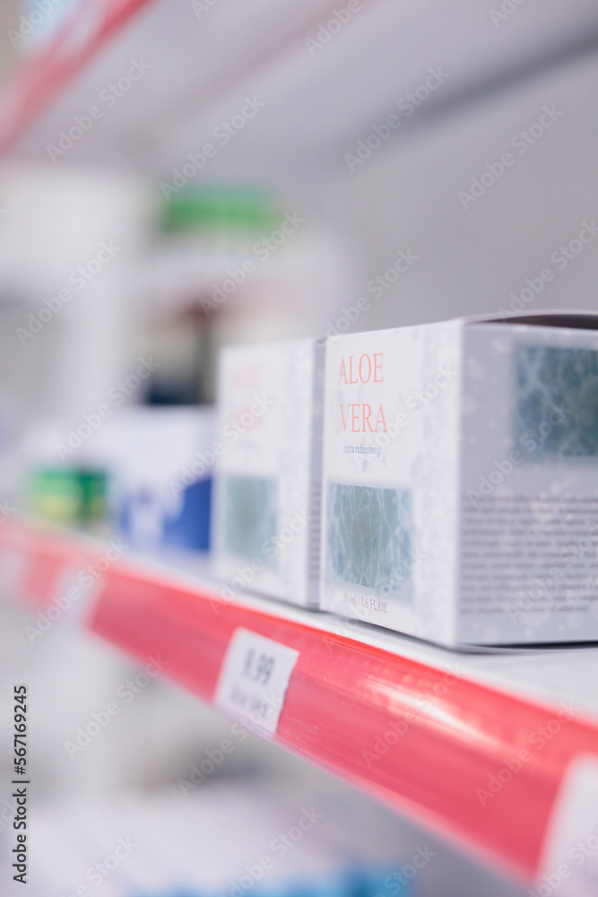 Drugstore shelves stocked with various medicinal products and aloe vera cream ready for clients to come and buy during checkup visit in pharmacy. Medicine support service and concept