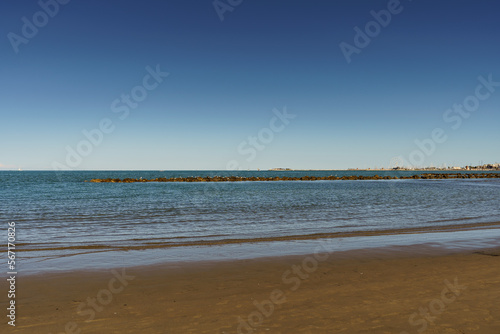 Fototapeta Naklejka Na Ścianę i Meble -  Calm sea overlooking a smooth sandy beach