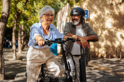 Senior couple with electric bikes.