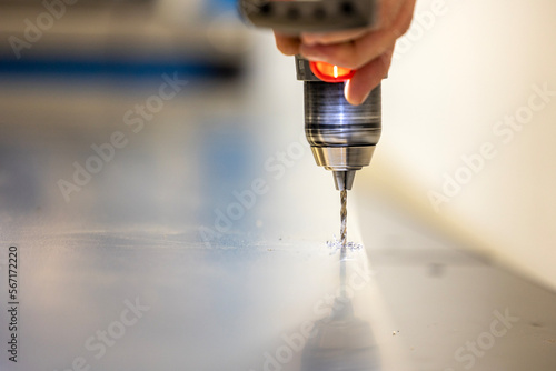 Drilling in a metal sheet