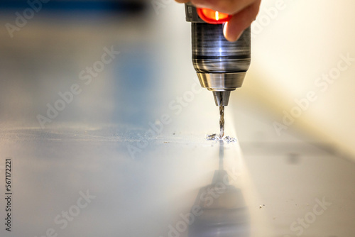 Drilling in a metal sheet