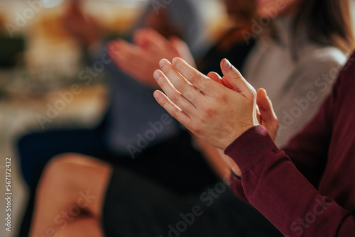 Closeup of hand clapping in meeting. © bernardbodo