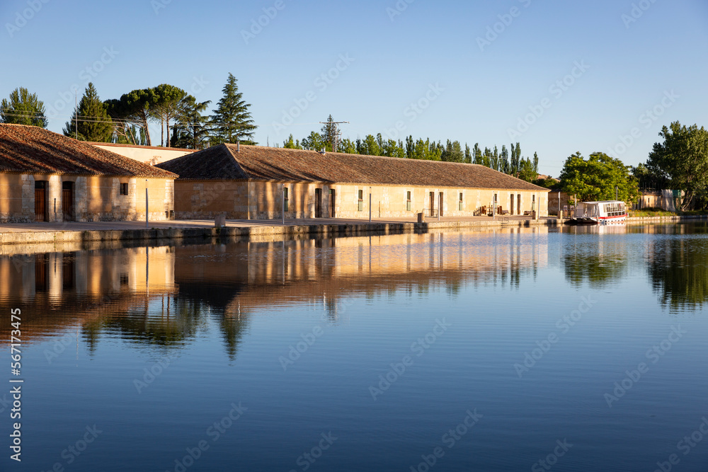 Fototapeta premium old buildings at Canal de Castilla dock - Ramal de Campos in Medina de Rioseco, province of Valladolid, Castile and Leon, Spain