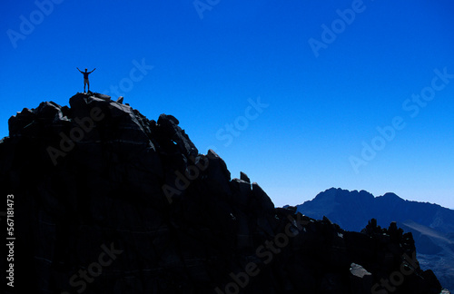 Man on top of mountain. photo