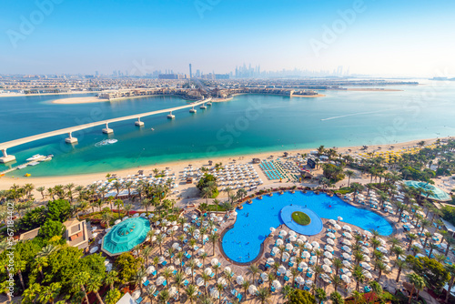 Фотография Balcony view of the grounds and swimming pool of the Atlantis Palm, an upscale resort at the Palm Jumeirah island complex, and the monorail tram, along the coast of Dubai, United Arab Emirates