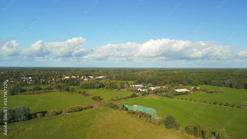 White clouds, blue sky, green grass landscape. Fabulous aerial view flight drone White clouds, blue sky, green grass landscape. Fabulous aerial view flight drone