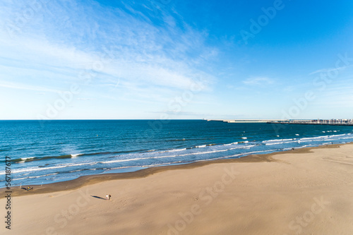 Aerial view of the beach of valencia and the coastline  late afternoon with waves  Spain