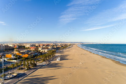 aerial of the beach with houses in the late afternoon, Valencia, Spain photo