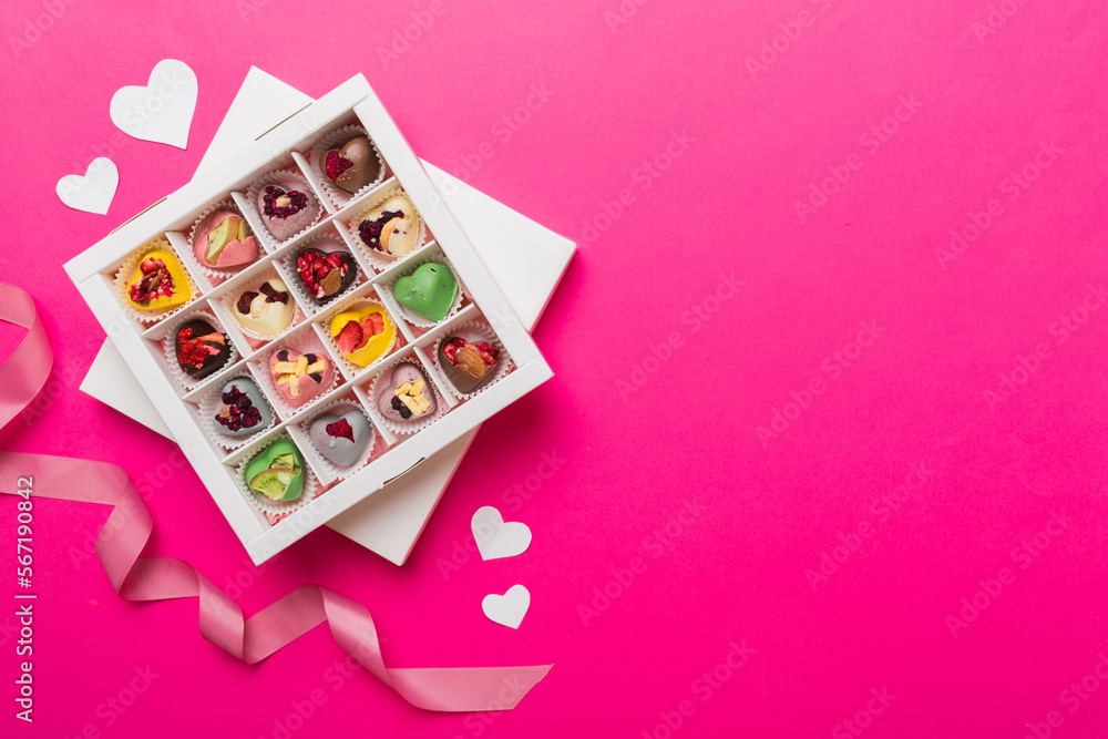 Valentine day composition: sweet candy, with gift boxes with bow and red felt hearts, photo template, background. Top View with copy space Valentine day composition: sweet candy, with gift boxes with bow and red felt hearts, photo template, background. Top View with copy space