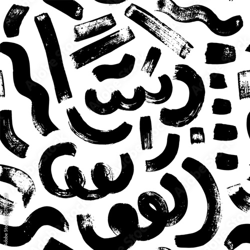 Geometric seamless pattern in Memphis style. Brush drawn curved lines, dashes and rough brush strokes. Seamless abstract vector black and white pattern. Grunge straight lines. 