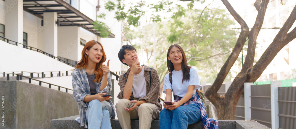 Attractive asian college student using laptop and tablet studying with group of friends together with english language classroom, social media and education concept. Attractive asian college student using laptop and tablet studying with group of friends together with english language classroom, social media and education concept.