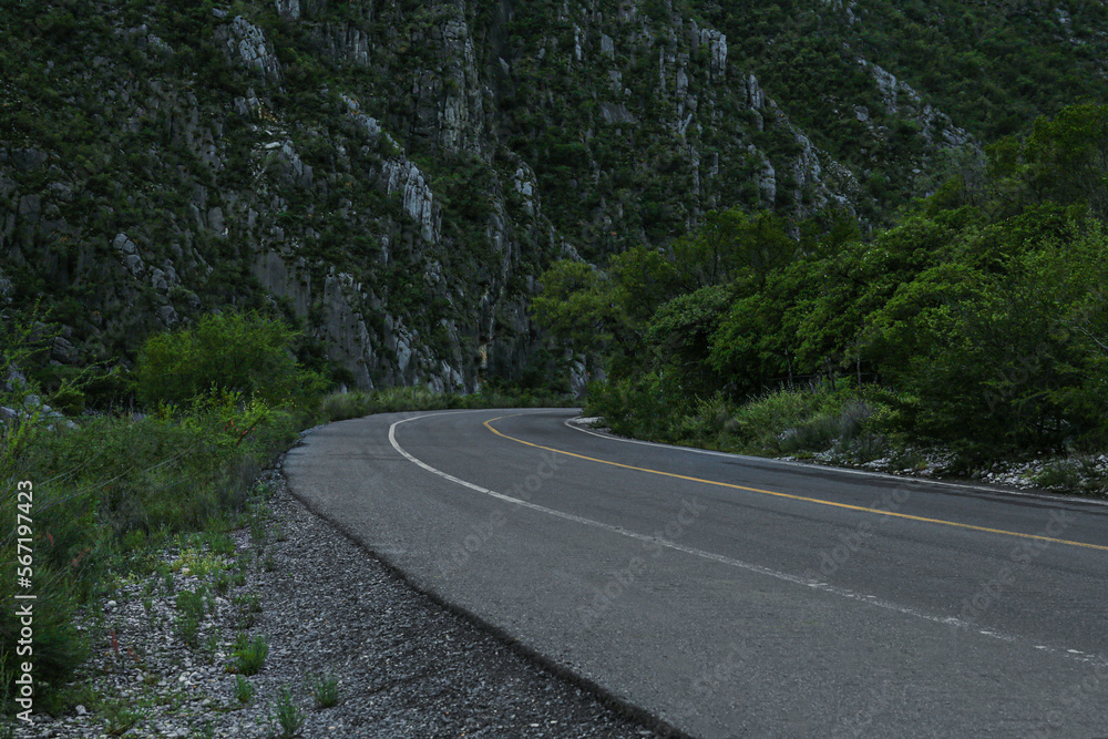 Fototapeta premium Beautiful view of empty asphalt highway near mountains outdoors. Road trip