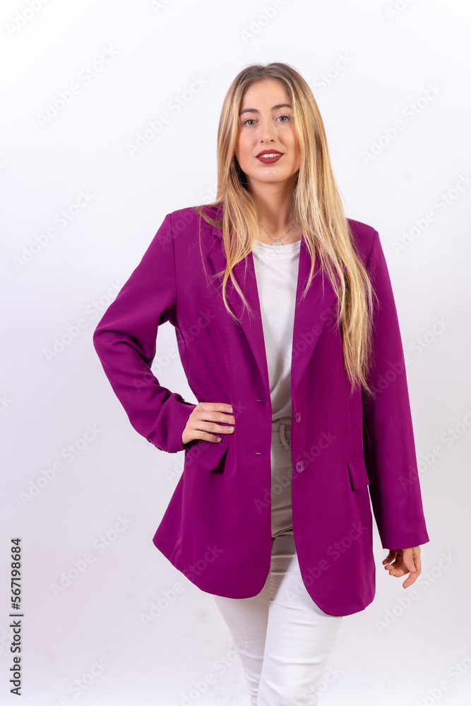 Blonde young woman in a portrait isolated on a white background, model in a purple trench coat