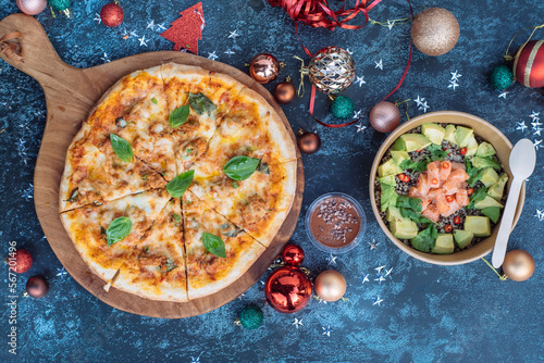 a pizzza sliced on a festive Christmas background