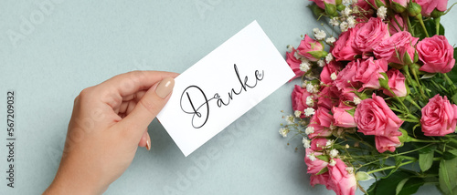 Female hand holding card wi...