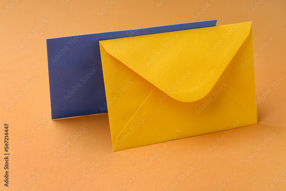 Two paper envelopes on color background Two paper envelopes on color background