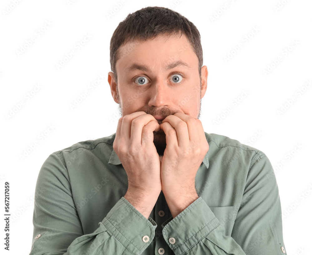 Handsome man in shirt biting nails on white background, closeup Handsome man in shirt biting nails on white background, closeup