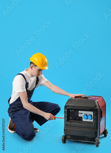 Male worker repairing porta...