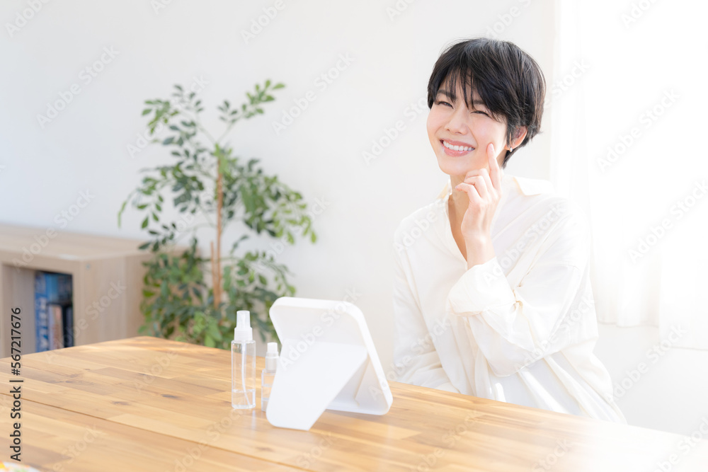 Beautiful Asian woman taking care of her skin at home Beautiful Asian woman taking care of her skin at home