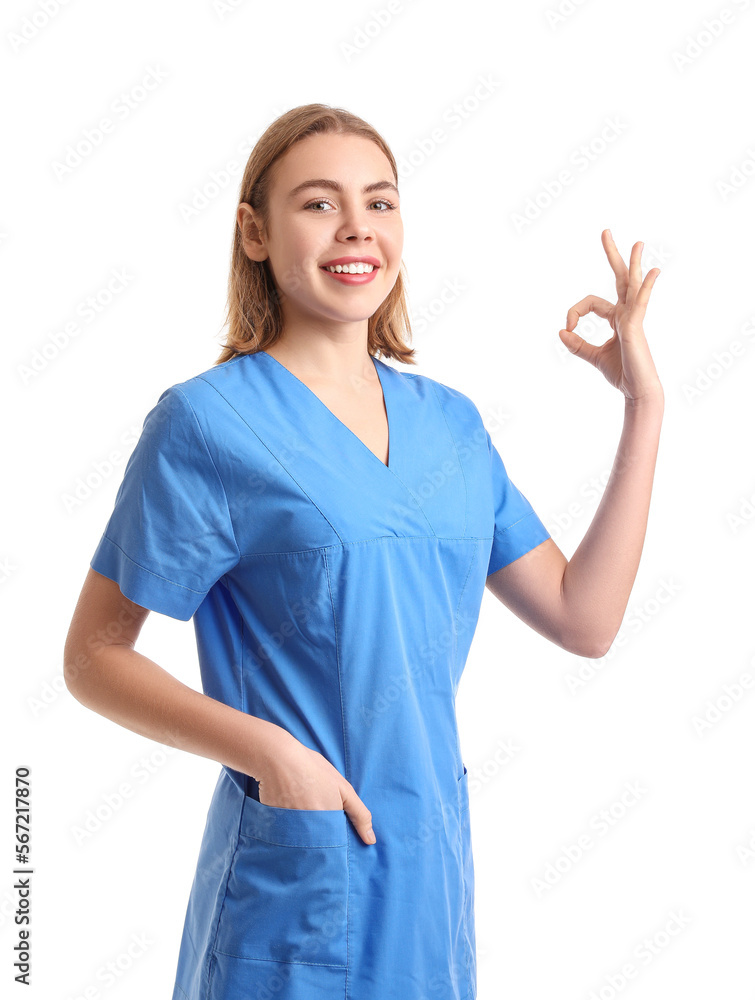 Female intern showing OK on white background Female intern showing OK on white background