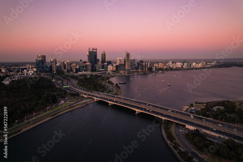 Aerial view of the Narrows bridge across the Swan River and the Perth skyline at sunset.