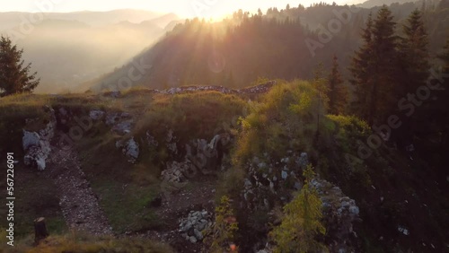 Drone footage of Rucar, a Romanian village showcasing autumn foliage and hill scenery. photo